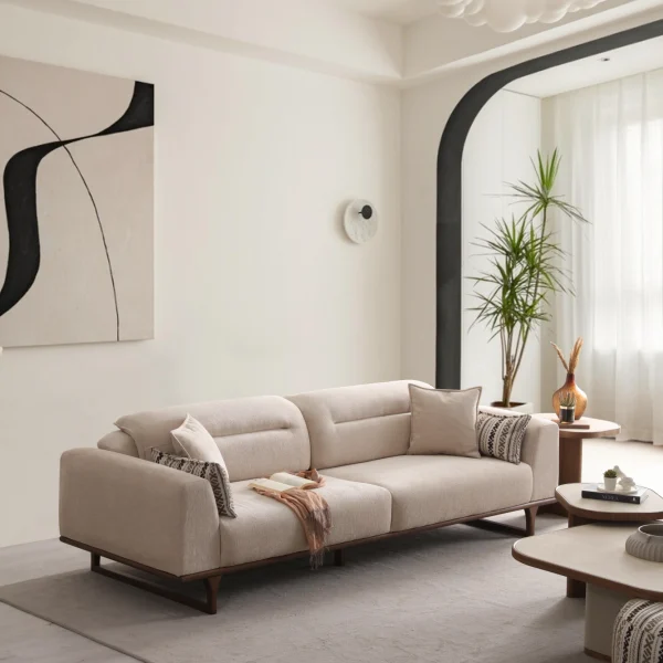 The Noa Sofa is a masterpiece of contemporary Turkish craftsmanship, designed exclusively for distinguished European homes. Its fluid, organic silhouette is upholstered in high-quality fabric that invites you to relax. This sofa is more than just a piece of furniture; it's a style statement that adds an airy, modern feel to any living space.