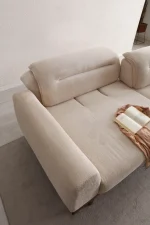 The Noa Sofa is a masterpiece of contemporary Turkish craftsmanship, designed exclusively for distinguished European homes. Its fluid, organic silhouette is upholstered in high-quality fabric that invites you to relax. This sofa is more than just a piece of furniture; it's a style statement that adds an airy, modern feel to any living space.