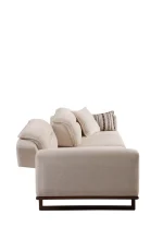 The Noa Sofa is a masterpiece of contemporary Turkish craftsmanship, designed exclusively for distinguished European homes. Its fluid, organic silhouette is upholstered in high-quality fabric that invites you to relax. This sofa is more than just a piece of furniture; it's a style statement that adds an airy, modern feel to any living space.