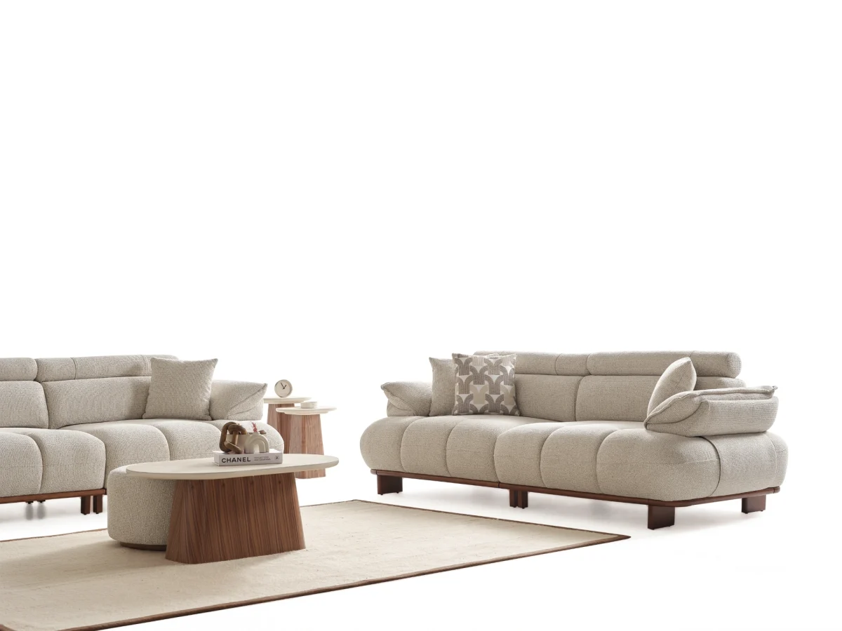 Experience comfort with the Nola Sofa Set. Its elegant fabric and curved silhouette offer a perfect blend of modern aesthetics and comfortable living.