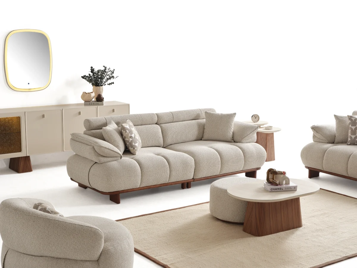 Experience comfort with the Nola Sofa Set. Its elegant fabric and curved silhouette offer a perfect blend of modern aesthetics and comfortable living.