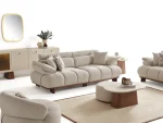 Experience comfort with the Nola Sofa Set. Its elegant fabric and curved silhouette offer a perfect blend of modern aesthetics and comfortable living.