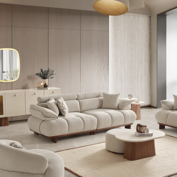 Experience comfort with the Nola Sofa Set. Its elegant fabric and curved silhouette offer a perfect blend of modern aesthetics and comfortable living.