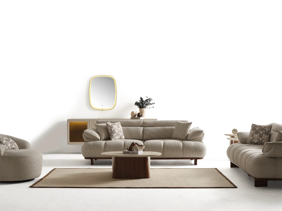 Experience comfort with the Nola Sofa Set. Its elegant fabric and curved silhouette offer a perfect blend of modern aesthetics and comfortable living.