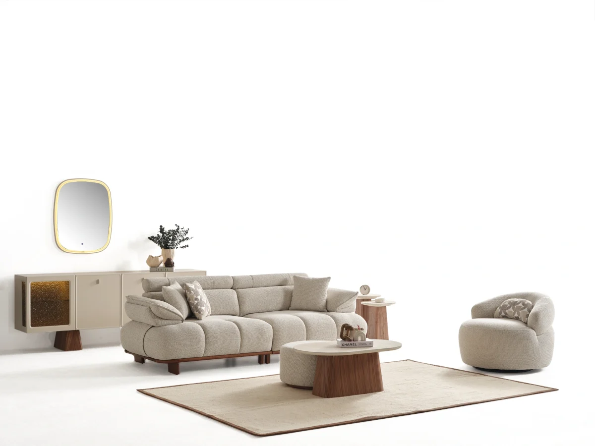 Experience comfort with the Nola Sofa Set. Its elegant fabric and curved silhouette offer a perfect blend of modern aesthetics and comfortable living.
