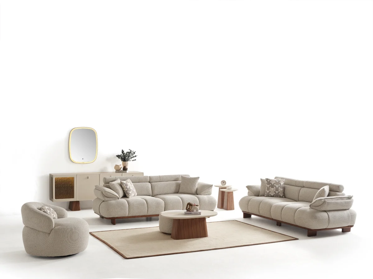 Experience comfort with the Nola Sofa Set. Its elegant fabric and curved silhouette offer a perfect blend of modern aesthetics and comfortable living.