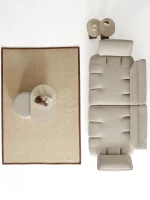 The Nola Sofa adds an architectural touch to your living room with its flowing lines and tactile richness. Experience comfort wrapped in the season's trendiest fabric.