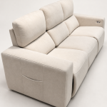 A modern three-seater power recliner sofa featuring plush double-pillow backrest cushions, wide upholstered armrests with side storage pockets, and soft textured fabric upholstery in a neutral setting.