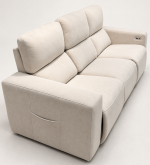 A modern three-seater power recliner sofa featuring plush double-pillow backrest cushions, wide upholstered armrests with side storage pockets, and soft textured fabric upholstery in a neutral setting.