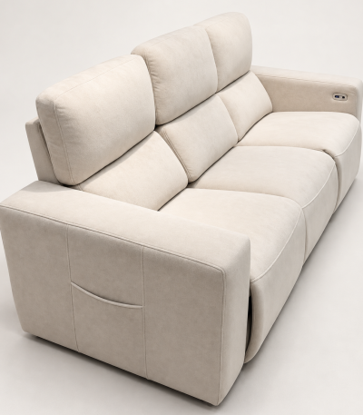 A modern three-seater power recliner sofa featuring plush double-pillow backrest cushions, wide upholstered armrests with side storage pockets, and soft textured fabric upholstery in a neutral setting.