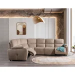 A spacious L-shaped sectional sofa featuring high back support cushions, smooth recliner functions, soft rounded armrests, and premium neutral textured upholstery set in an architectural living room.