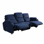 A modern three-seater reclining sofa featuring generous pillow-top backrests, wide padded armrests, and smooth plush upholstery set against a contemporary interior wall.