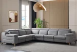 A modern L-shaped sectional sofa featuring integrated recliner functions, adjustable multi-position headrests, plush cushioned armrests, and subtle wooden support legs in a contemporary interior setting.