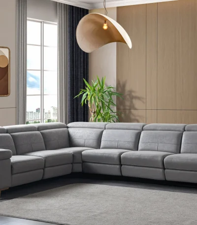 A modern L-shaped sectional sofa featuring integrated recliner functions, adjustable multi-position headrests, plush cushioned armrests, and subtle wooden support legs in a contemporary interior setting.