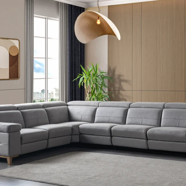 A modern L-shaped sectional sofa featuring integrated recliner functions, adjustable multi-position headrests, plush cushioned armrests, and subtle wooden support legs in a contemporary interior setting.