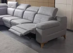 A modern L-shaped sectional sofa featuring integrated recliner functions, adjustable multi-position headrests, plush cushioned armrests, and subtle wooden support legs in a contemporary interior setting.