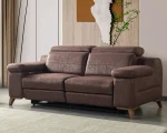 A modern multi-seater recliner sofa featuring adjustable headrests, extendable footrests, wide plush armrests, and a rich textured leatherette finish in a contemporary living room setting.