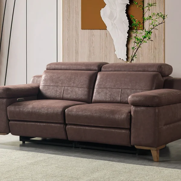 A modern multi-seater recliner sofa featuring adjustable headrests, extendable footrests, wide plush armrests, and a rich textured leatherette finish in a contemporary living room setting.