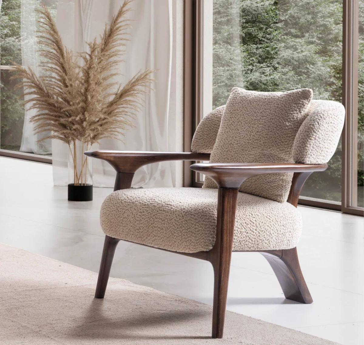 Sola Armchair with an exposed wooden frame, smooth wooden armrests, and a curved cushioned backrest