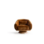 The Thalia Armchair offers a sophisticated seating experience, wrapped in rich, tactile fabric. Its base and seat create the perfect reading nook or decorative piece.