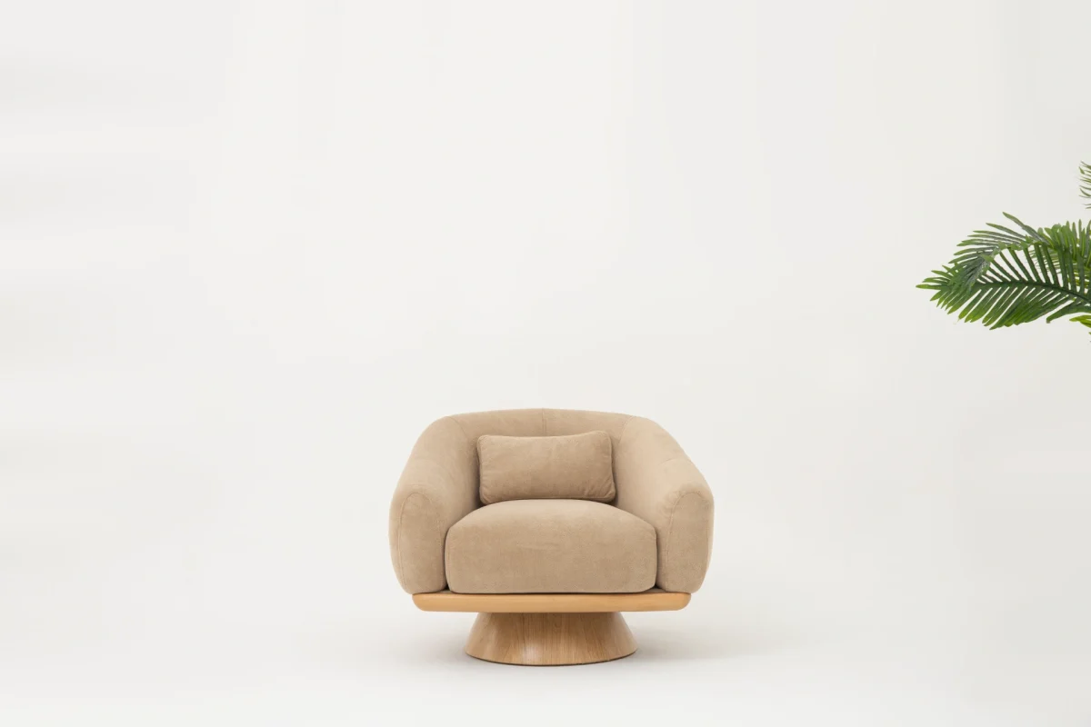 The Thalia Armchair offers a sophisticated seating experience, wrapped in rich, tactile fabric. Its base and seat create the perfect reading nook or decorative piece.