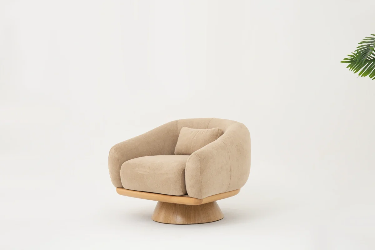 The Thalia Armchair offers a sophisticated seating experience, wrapped in rich, tactile fabric. Its base and seat create the perfect reading nook or decorative piece.