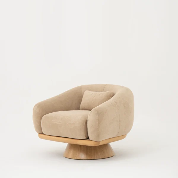 The Thalia Armchair offers a sophisticated seating experience, wrapped in rich, tactile fabric. Its base and seat create the perfect reading nook or decorative piece.