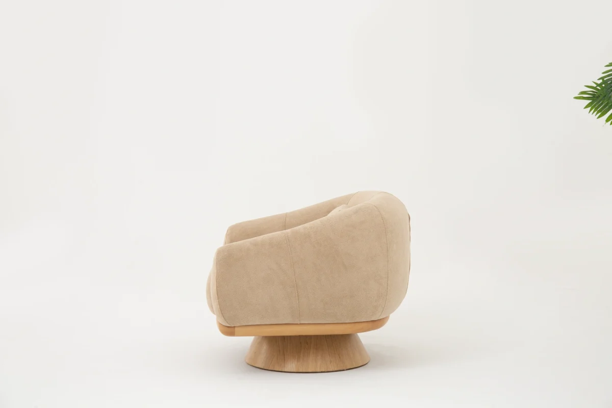 The Thalia Armchair offers a sophisticated seating experience, wrapped in rich, tactile fabric. Its base and seat create the perfect reading nook or decorative piece.