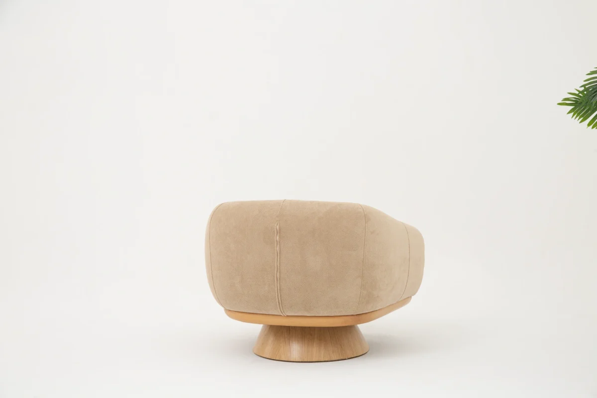 The Thalia Armchair offers a sophisticated seating experience, wrapped in rich, tactile fabric. Its base and seat create the perfect reading nook or decorative piece.