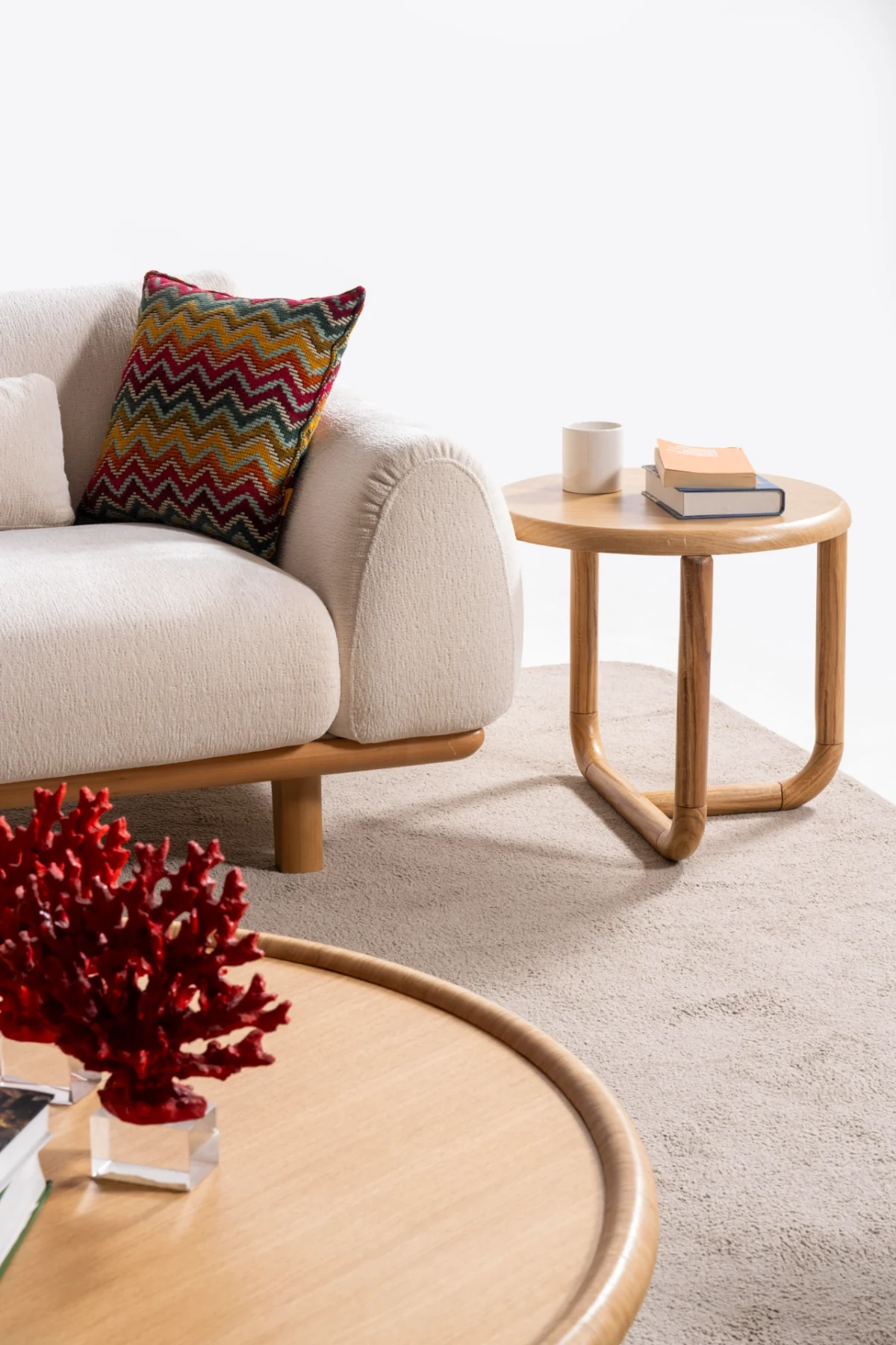 The Thalia Sofa combines organic, rounded lines with the rich texture of premium fabric. A bold piece that brings modern warmth to any living room.