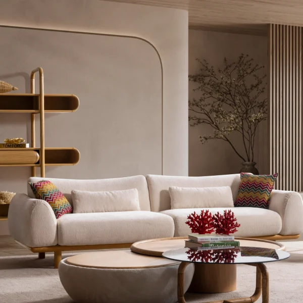 The Thalia Sofa combines organic, rounded lines with the rich texture of premium fabric. A bold piece that brings modern warmth to any living room.