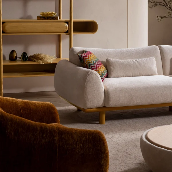 The Thalia Sofa combines organic, rounded lines with the rich texture of premium fabric. A bold piece that brings modern warmth to any living room.
