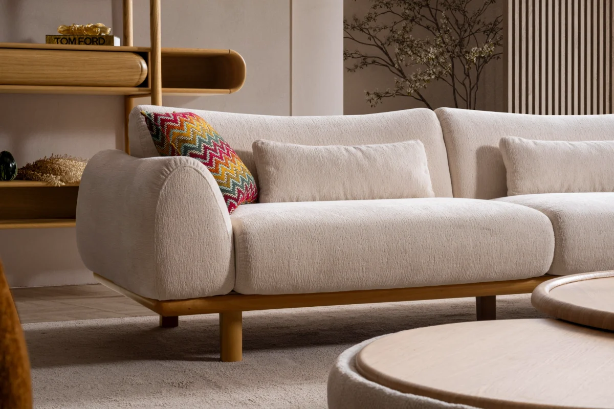 The Thalia Sofa combines organic, rounded lines with the rich texture of premium fabric. A bold piece that brings modern warmth to any living room.