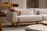 The Thalia Sofa combines organic, rounded lines with the rich texture of premium fabric. A bold piece that brings modern warmth to any living room.