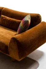 The Thalia Sofa combines organic, rounded lines with the rich texture of premium fabric. A bold piece that brings modern warmth to any living room.