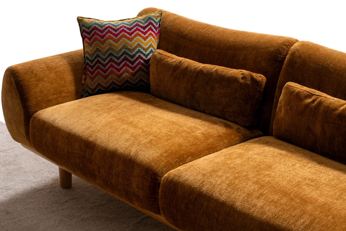 The Thalia Sofa combines organic, rounded lines with the rich texture of premium fabric. A bold piece that brings modern warmth to any living room.