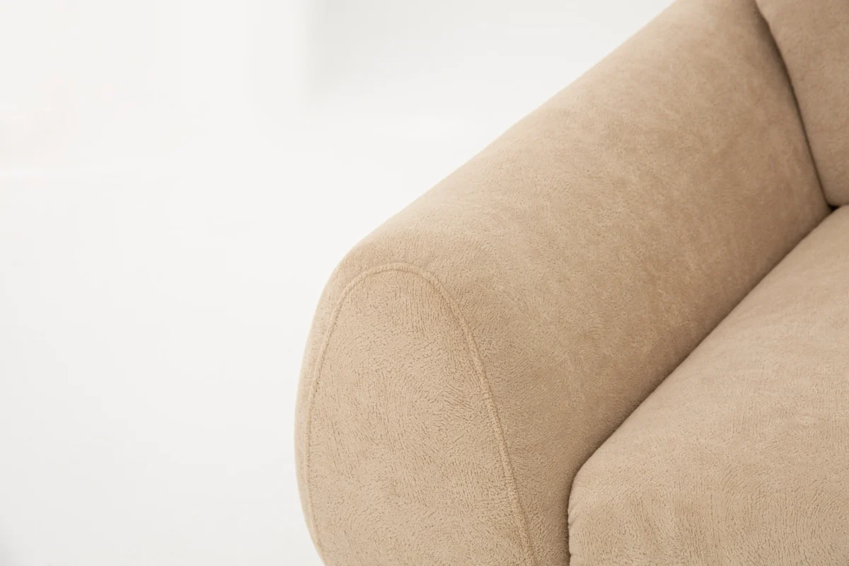 The Thalia Sofa combines organic, rounded lines with the rich texture of premium fabric. A bold piece that brings modern warmth to any living room.