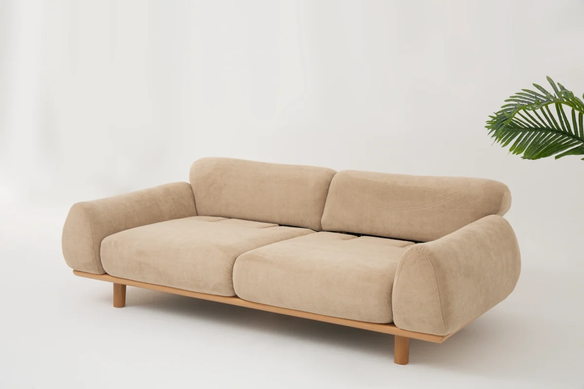 The Thalia Sofa combines organic, rounded lines with the rich texture of premium fabric. A bold piece that brings modern warmth to any living room.