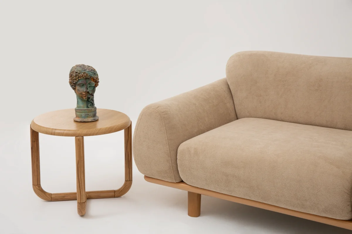 The Thalia Sofa combines organic, rounded lines with the rich texture of premium fabric. A bold piece that brings modern warmth to any living room.