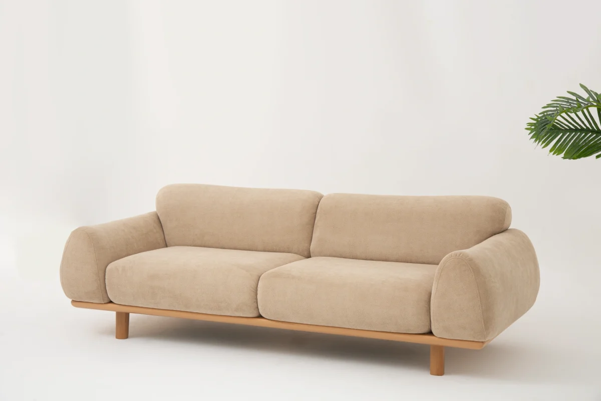 The Thalia Sofa combines organic, rounded lines with the rich texture of premium fabric. A bold piece that brings modern warmth to any living room.