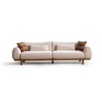 The Thalia Sofa combines organic, rounded lines with the rich texture of premium fabric. A bold piece that brings modern warmth to any living room.