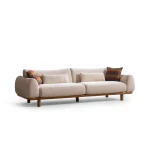 The Thalia Sofa combines organic, rounded lines with the rich texture of premium fabric. A bold piece that brings modern warmth to any living room.