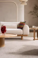 The Thalia Sofa combines organic, rounded lines with the rich texture of premium fabric. A bold piece that brings modern warmth to any living room.