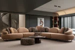 Tolia Corner Sofa - 5 Modules five-piece modular curved corner sofa featuring warm beige seating, patterned accent cushions, and an integrated wooden console table.