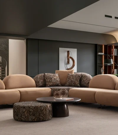 Tolia Corner Sofa - 5 Modules five-piece modular curved corner sofa featuring warm beige seating, patterned accent cushions, and an integrated wooden console table.