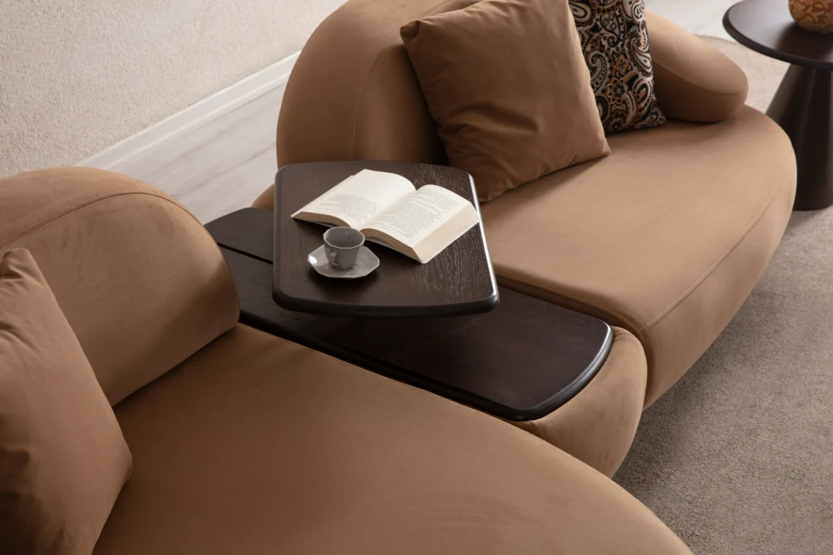 Tolia Chaise Corner Sofa – 3 Module (Wooden Middle Module) featuring soft beige seating units, a central wooden console table, and comfortable throw cushions in a warm interior design setup.