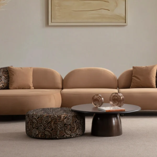Tolia Chaise Corner Sofa - 3 Module three-piece modular curved sofa featuring an extended chaise end, warm beige upholstery, and plush decorative cushions.