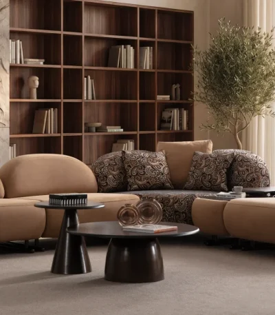 Tolia Corner Sofa - 4 Modules five-piece modular curved corner sofa featuring warm beige seating, patterned accent cushions, and an integrated wooden console table.