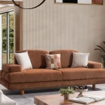 Modern living room featuring the Troyas sofa set in a warm terracotta hue, showcasing soft curves and a textured finish for a cozy, contemporary aesthetic – SofaTurkey.