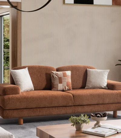 Modern living room featuring the Troyas sofa set in a warm terracotta hue, showcasing soft curves and a textured finish for a cozy, contemporary aesthetic – SofaTurkey.